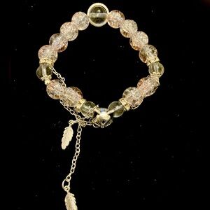 Silver and clear crystal bracelet with heart charm and feather charm
18cm/7.08in